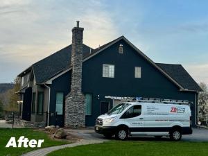 Picture of the restored house at a sunset with ZD Stucco Repair van