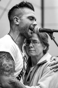 Jay Allen embraces his mother, Sherry, whose battle with Alzheimer’s inspired his anthem “Blank Stares”.