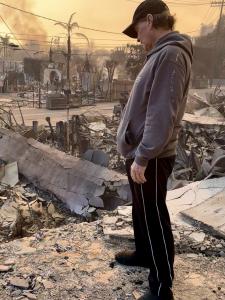 Gerry Blanck surveys the ashes of his beloved Pacific Palisades dojo, destroyed in the LA fires. A May 17 fundraiser at Hilton Santa Monica aims to help rebuild and restore hope for Gerry and his students. Photo credit: Sensei Gerry.