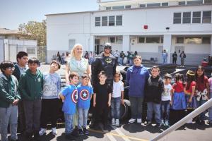 Hazel Ortega and Batman brought smiles and inspiration to the students of Our Lady of Guadalupe School during the Hero Initiative, standing proudly beside the Batmobile in the heart of the schoolyard—a day filled with imagination, empowerment, and fun.