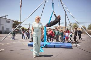 Surrounded by joy and energy, Hazel Ortega joins the talented acrobat artists and students who participated in playful stunt training, turning the schoolyard into a superhero playground for the Hero Initiative