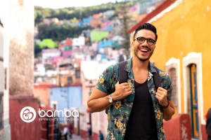 Happy male influencer on vacation - Bamba Travel