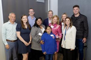 Brad Keller, Crane Kenney, and Lea Jesse pose with Cubs Charities' community partners