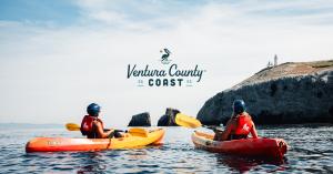 Two people kayaking at the Channel Islands National Park and enjoying the view of the Lighthouse. California Tourism Month, Ventura County Coast, CA travel, family vacation California, coastal road trip, California coast, multigenerational travel, Califor