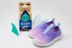 Easy Cleaning Erasers next to a Rugged Shark shoe with the sponges placed on either side on a white background