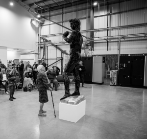 Carbon David with Lady Looking Up At Him