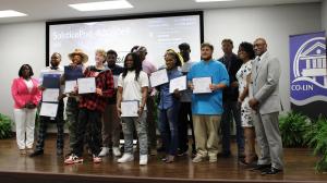 The first graduating class of the new Building Trades Training Program pose with their newly awarded certificates alongside their instructor and Natchez Workforce Team.