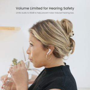 A young child wearing PuroQuiet Air true wireless headphones, smiling and listening comfortably in a bright, casual setting—highlighting safe, stylish audio use