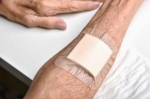A wounded arm with a regenerative therapy bandage to accelerate recovery