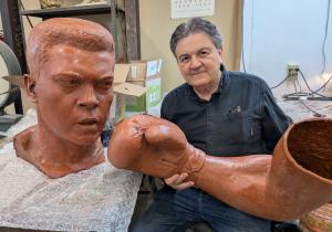 Sculptor Zenos Frudakis works on wax casts of his Muhammad Ali statue at the Laran Bronze Foundry in Chester, Pa.