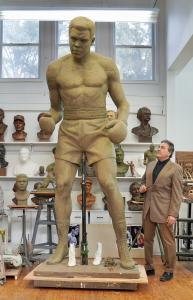 Sculptor Zenos Frudakis working on his 10-foot Muhammad Ali statue in clay at his studio outside Philadelphia.