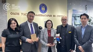 Mrs. Tamir Baatar, COO of EBC Mongolia, with IUU management celebrating a partnership to support Mongolia’s future financial professionals. 