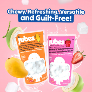 Close-up of Jubes Coconut Jelly product display at the 2025 Sweets & Snacks Expo, featuring colorful packaging and sample cups for visitors.