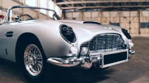 Aston Martin DB5 Junior 'No Time to Die Edition' displaying Gatling guns hidden under the headlights
