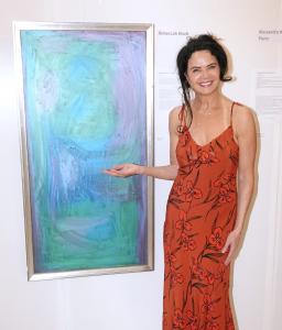 Artist Rebeccah Klodt alongside the work of art