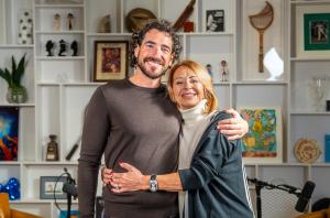 Alex Perry and his mom, Josefine Perry, embrace after recording their first episode of the Alex Perry On Fire podcast together.
