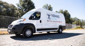 Picture of the Nomad Fit Lab DEXA scan sprinter van in a parking lot
