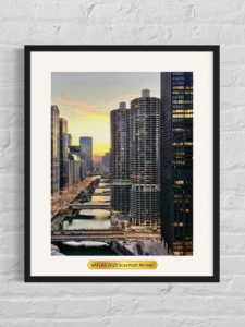 Photo of the trophy, the Chicago River at sunset with a plaque commemorating "eATLAS 2025 ScavHunt Winners"