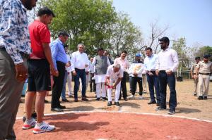 A group of people gathers around a baseball field as Shri Anoop Mishra, Hon’ble Former Cabinet Minister and Member of Parliament, breaks ground for India's first professional baseball park.