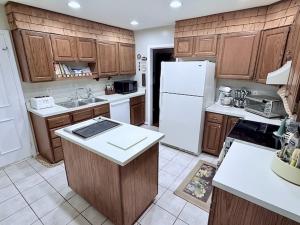 This home measures 2,796 +/- sf. (1,788 +/- sf. above grade & 1,008 +/- sf. basement), and features a large eat-in kitchen (all appliances convey) w/large pantry & built-in desk; formal living room; dining room; attic; attached 2 car garage (576 +/- sf.)