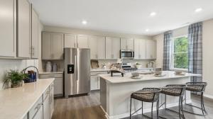 kitchen with gray cabinets and quartz countertops