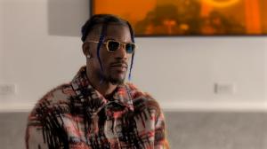 NBA star Jimmy Butler (donning blue braids, a patterned shirt and sunglasses) discusses the launch of his first BIGFACE coffee shop in Miami. (Cortney Danielle Moore/South Florida Business Journal)