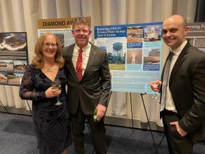 Peter J. Connell, P.E. of D&B celebrates the “Replacement of 1.5 MG Syosset Elevated Tank” winning project with Peter Logan of Jericho Water District and his wife, Diane.