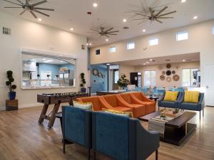 recreation rooms showing comfortable couches and chairs and games
