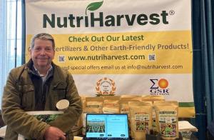 Vermont Agriculture Secretary Anson Tebbetts visits the booth showcasing organic fertilizer products, made on-farm using GSR’s biotechnology, during the NTCC Conference at the Hilton Hotel. (Courtesy of GSR Solutions)