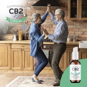 CB2 Topical Oil with couple dancing in the kitchen