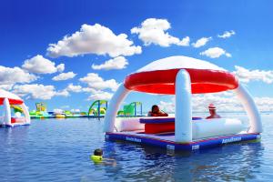 Family relaxing on floating cabanas next the the WhoaZone at Grapevine.