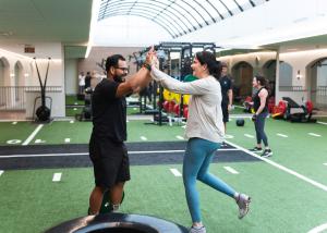 personal trainer giving high five