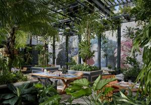 Image of the outdoor dining area of Copa restaurant at the 25hours Hotel The Oddbird, Jakarta, designed by EDG