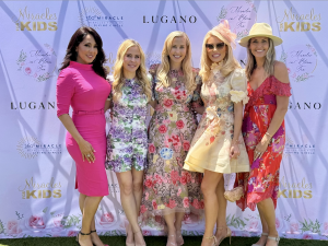 ladies in floral dresses at the Miracles in Bloom Spring Tea, in the picture are these celebrities: Michelle Valles (NBCLA), Tara Lipinski (Olympic Gold Medalist), Autumn Strier (Co-founder & CEO of Miracles for Kids, Gretchen Rossi (RHOC), Crystal Egger