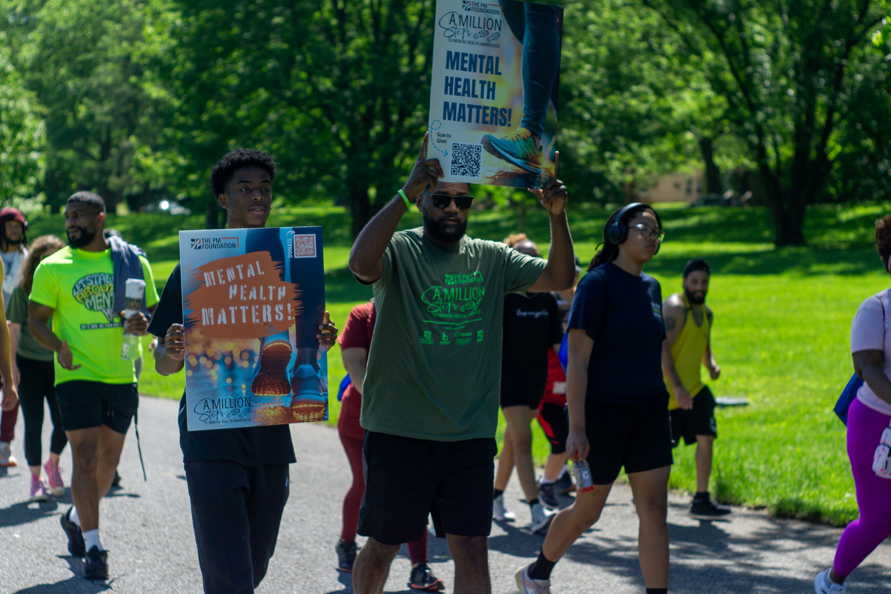 Tyrone Russell, Chief People Officer, Preventive Measures with walkers in Cedar Beach Park