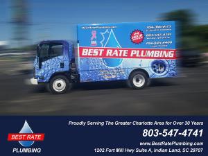 Plumber Van in Indian Land SC features large vinyl graphics with huge water drop logo and water spray background.