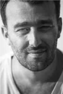 Portrait of Réhahn, artist known for Impressionist photography and cultural storytelling