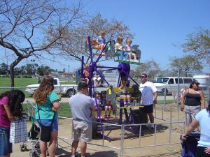 Ferris Wheel Rental in Houston by Dino Jump USA at a school carnival event