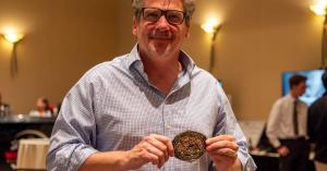 Jonathan Hunter of Ziz Defense display the Judges' Overall Winner's Belt Buckle after claiming victory at the Pendleton Innovator Showcase.