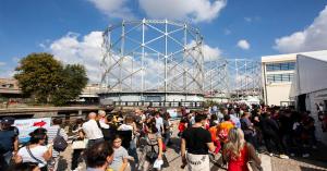Crowds explore Maker FaireRome  at Rome’s iconic Gazometro under sunny skies.