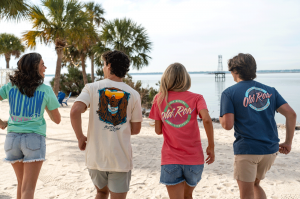 Friends running on the beach