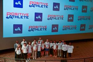 Champ Bailey joins 2025 Positive Athlete Colorado award winners for a group photo.