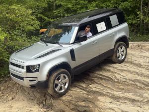 A Land Rover Defender descends a rock wall at Southington Off-Road Park in Ohio.