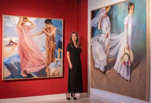 Sefora with two of her artworks.