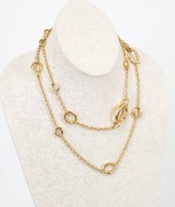 Gucci signed 18k yellow gold bamboo link station necklace, nearly 28 inches long, a cable chain with grooved oval-shaped bamboo motif stations, stamped 750. Estimate: $7,000-$9,000