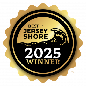 Gold medallion badge with a wave graphic and text reading “Best of Jersey Shore 2025 Winner.”