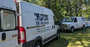  MRC Restoration service vans parked on a residential property in Bonne Terre, Missouri, during an emergency water damage cleanup response.