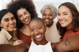 Image of group of smiling women of mixed ethnicities