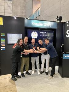 XENOptics and Senko Team accepting Interop 2025 Award