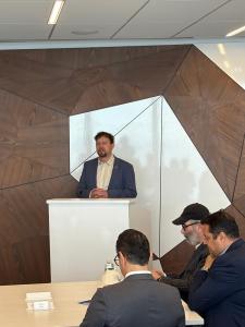 David Marshall, VP of Sustainability Governance & Reporting at Domtar, speaking at a podium during the World Sustainability Leadership Forum 2025 in New York, with attendees seated in front
